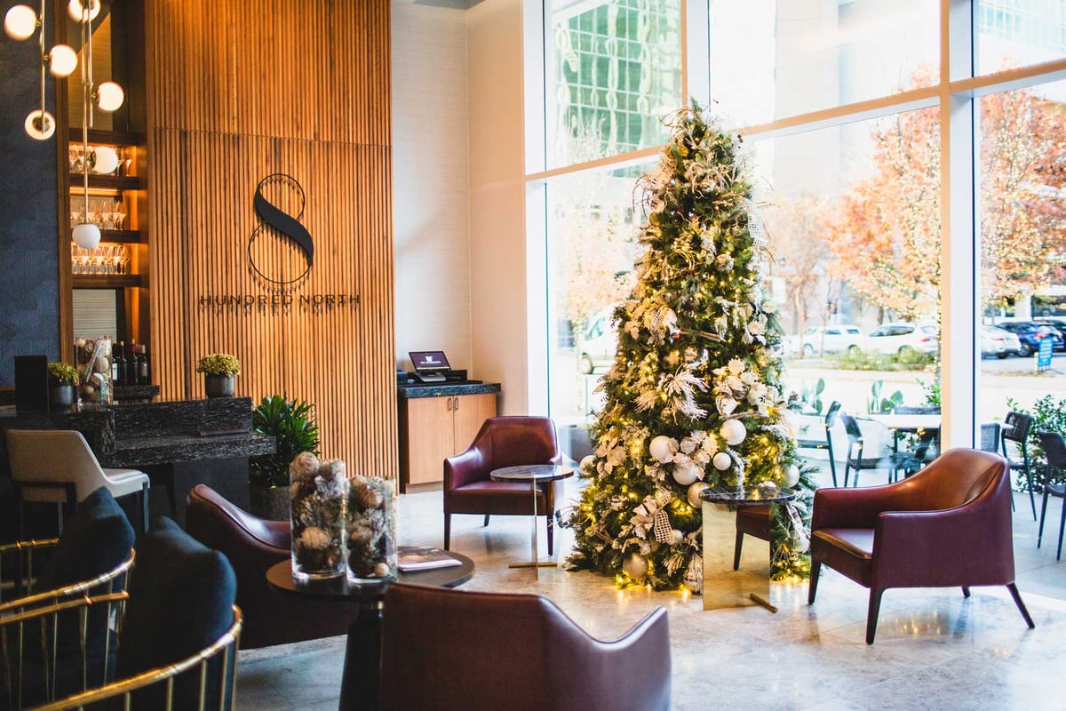 White and Ivory Christmas tree in a lobby space