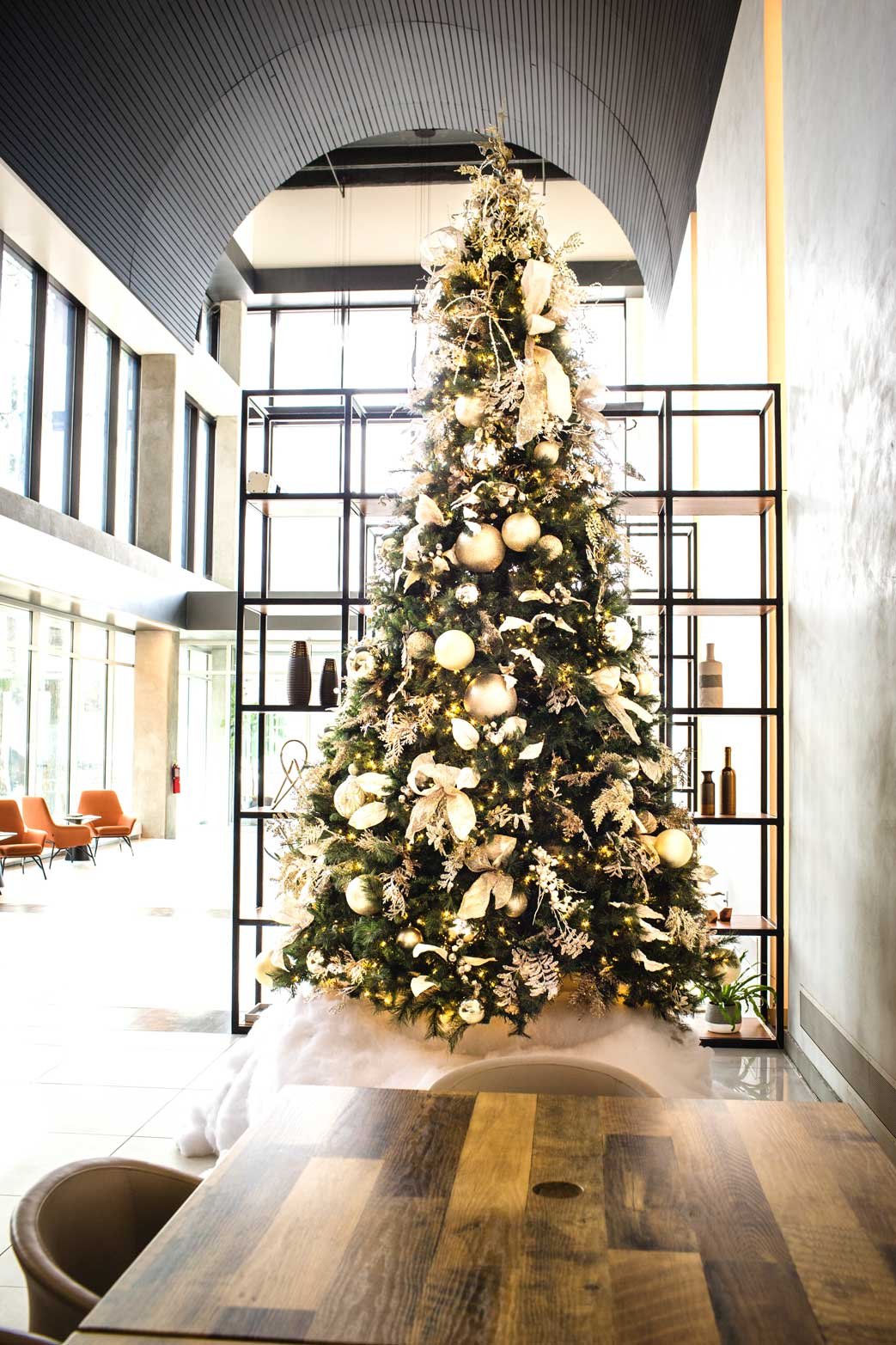 Ivory and white Christmas tree in a multitenant office space