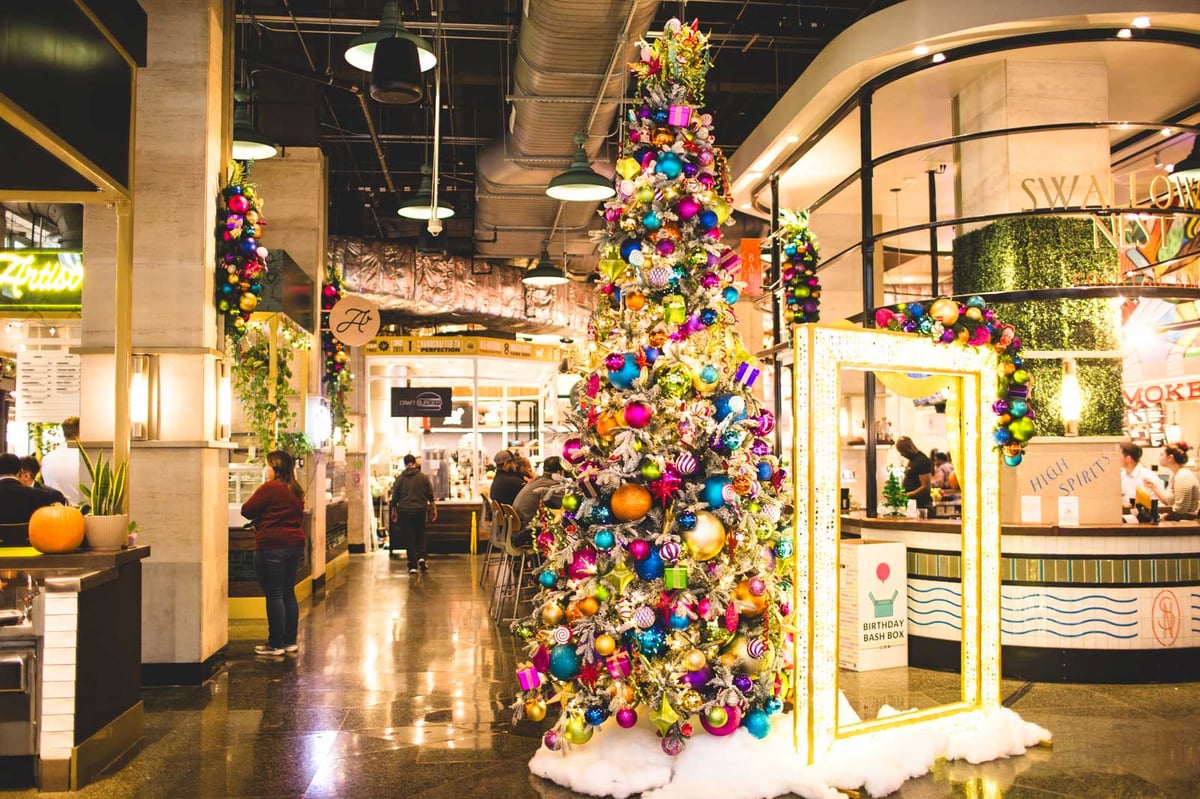 Multi-colored christmas tree in a bank lobby