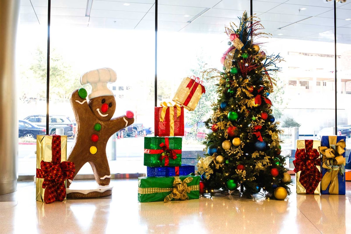 Multi-colored christmas tree with gingerbread man and giftbox decor