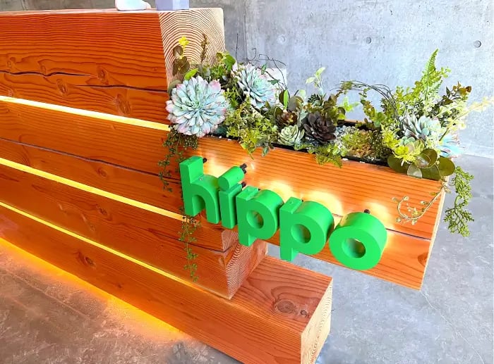 plants on top of a business logo in the reception