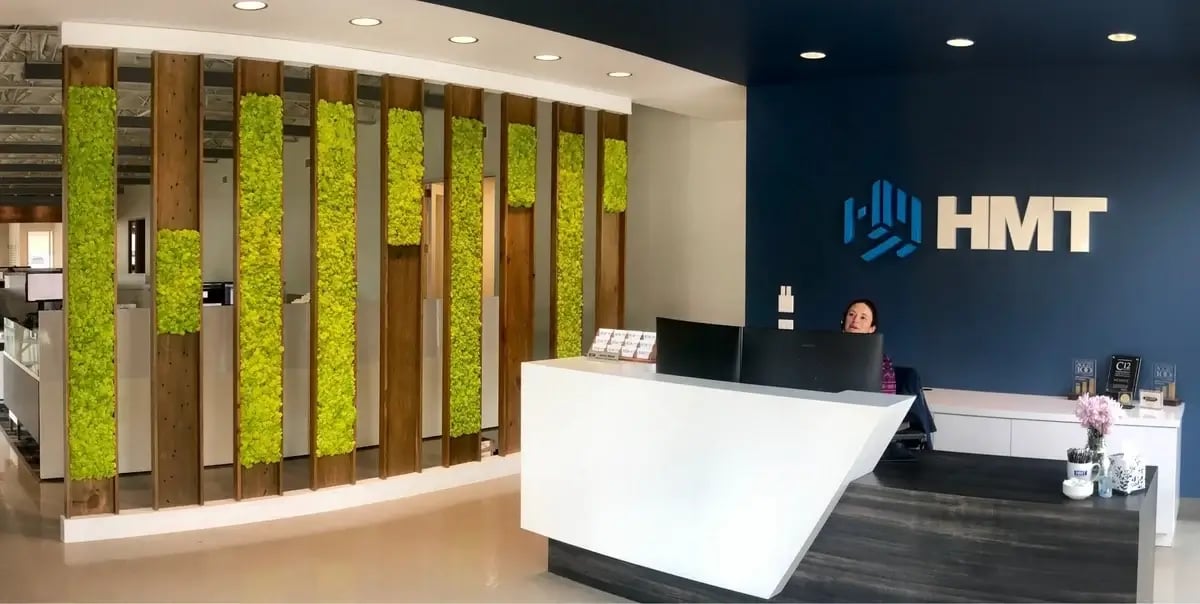 Multiple small moss walls in an office lobby