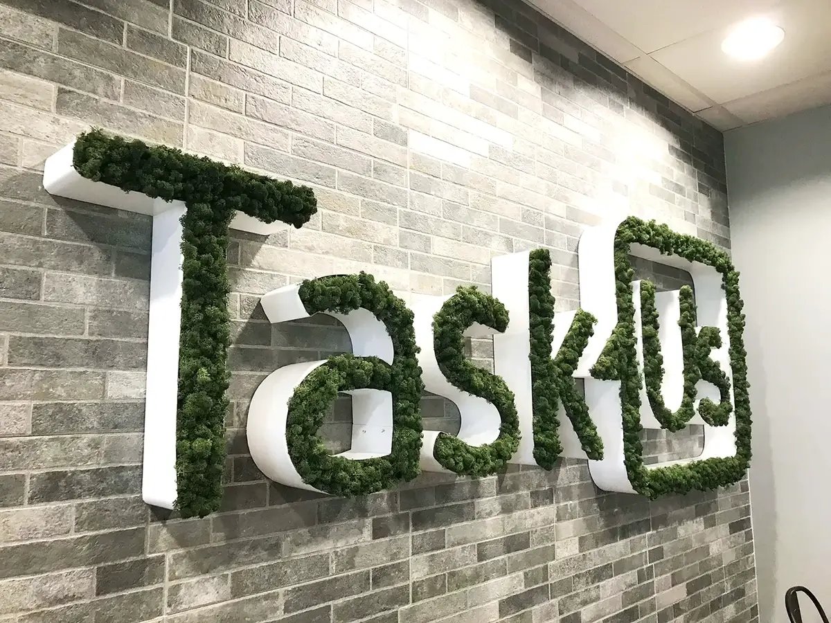 Moss wall / sign featuring brand logo