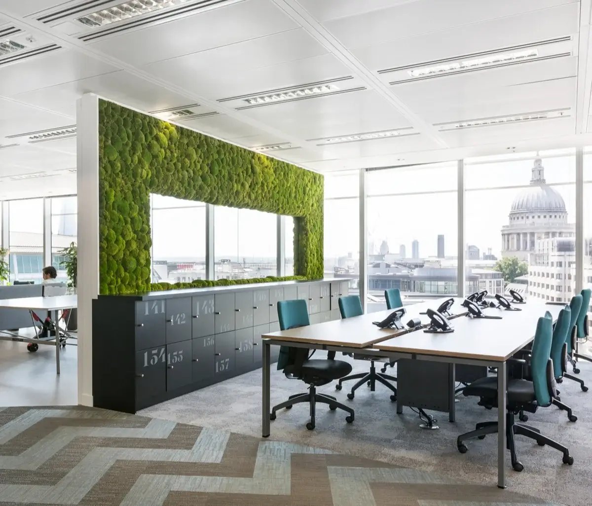 a moss wall divider to divide the office into two parts