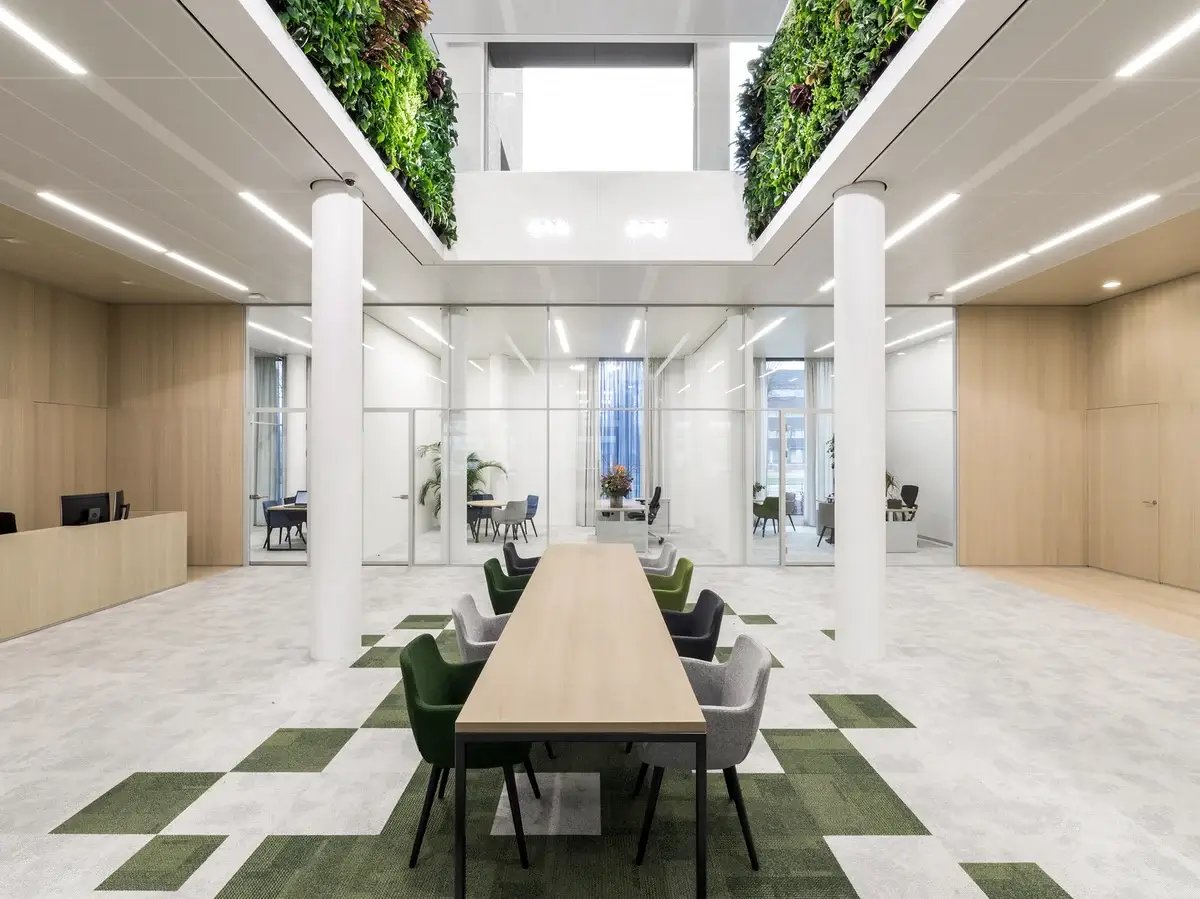 grass on the floor between tiles and on the sides of the balcony are two living walls 