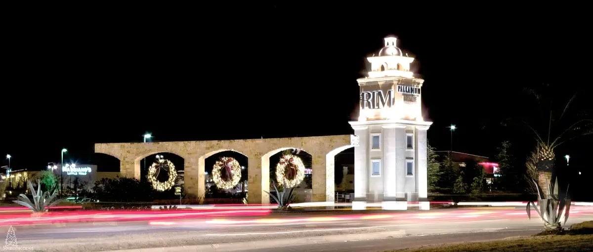 three large, lighted, hanging wreaths 